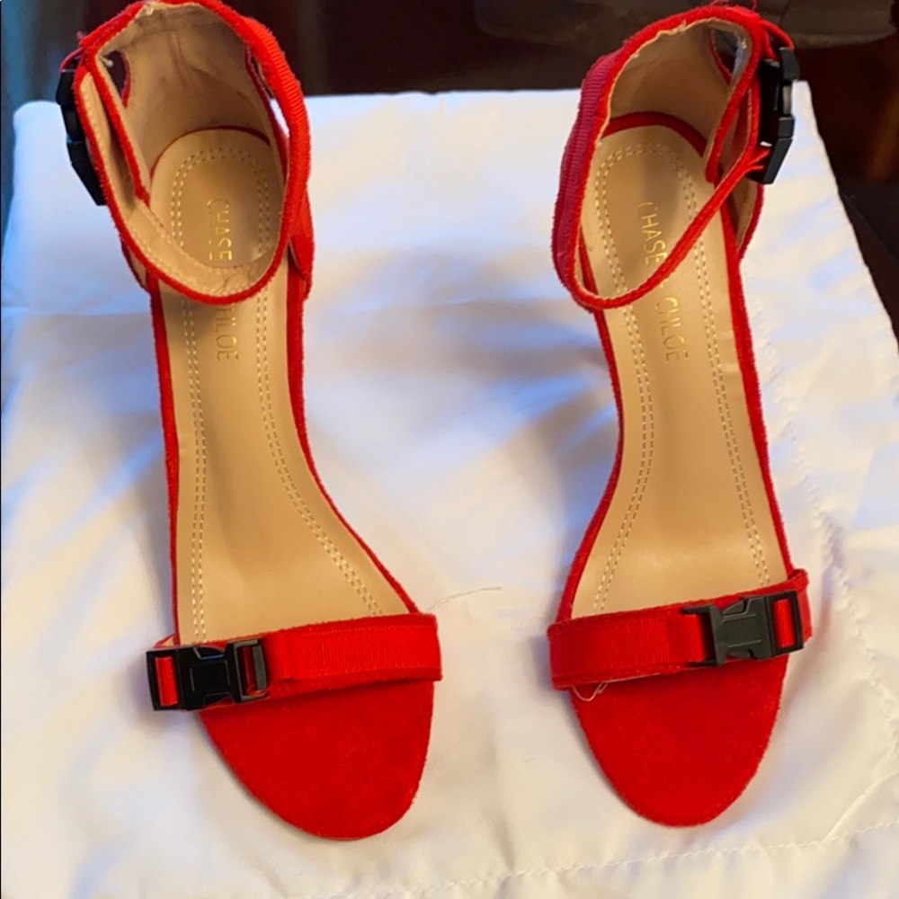 Strap heels , red orange color .